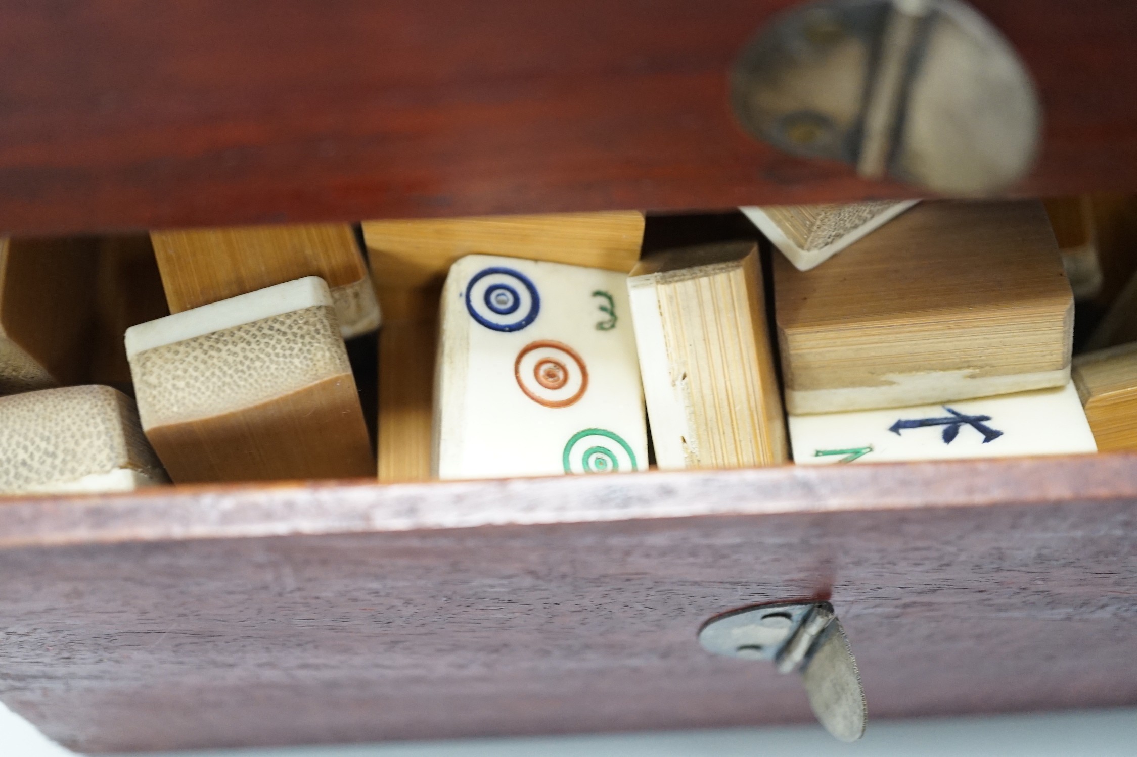 A 20th century MahJong set, together with playing racks with ivorine inlay